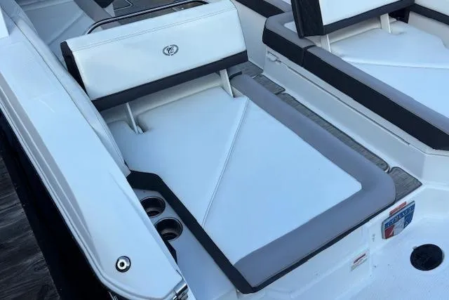 Slide: The Image of 2021 Cobalt R6 Outboard boat interior with white seating and cup holders. - 10