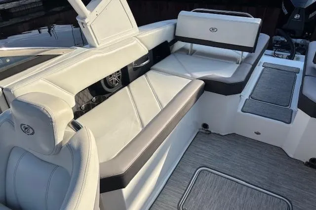 Slide: The Image of 2021 Cobalt R6 Outboard boat interior with white and gray seating, showcasing luxury design. - 14