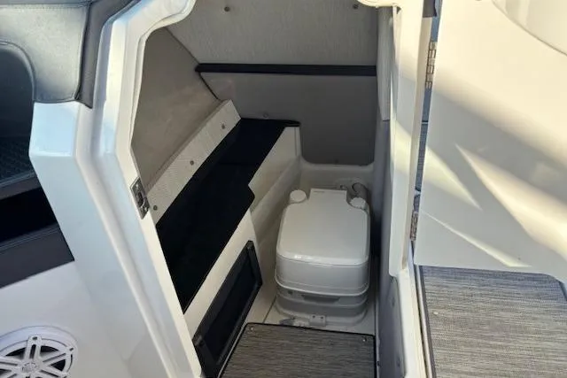 Slide: The Image of 2021 Cobalt R6 Outboard boat interior with compact marine toilet. - 20