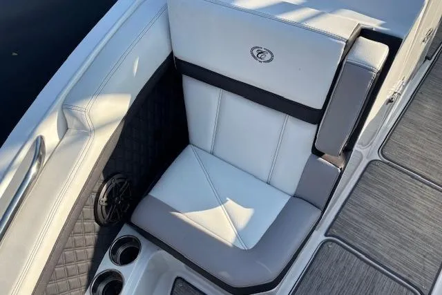 Slide: The Image of 2021 Cobalt R6 Outboard boat interior with white seating and cup holders. - 22