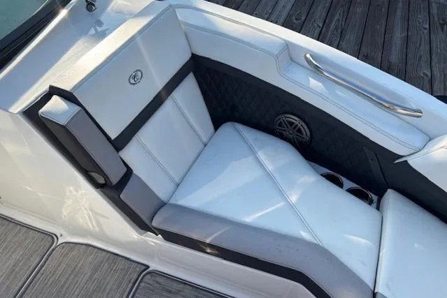 Slide: The Image of 2021 Cobalt R6 Outboard boat interior with white seating and speaker detail. - 23
