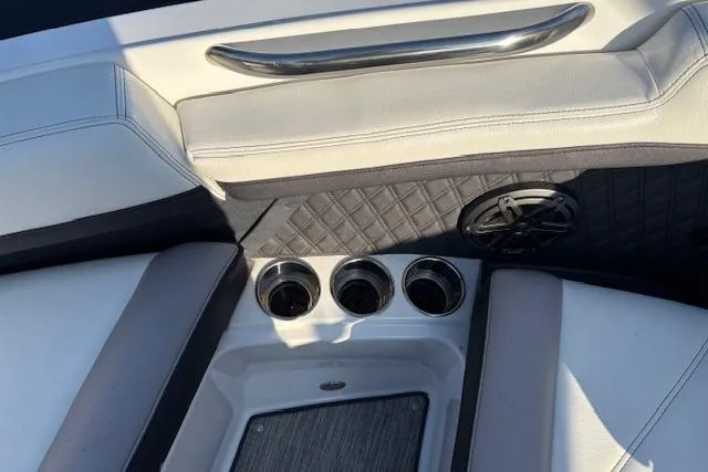 Slide: The Image of Interior of 2021 Cobalt R6 Outboard boat with cup holders and speaker. - 25