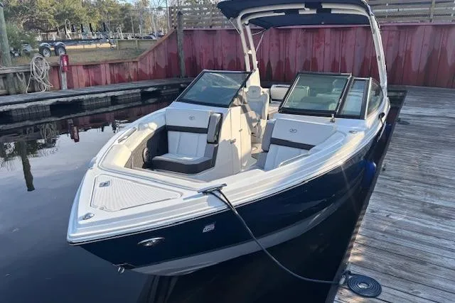 Slide: The Image of 2021 Cobalt R6 Outboard boat docked, featuring sleek design and spacious seating. - 3