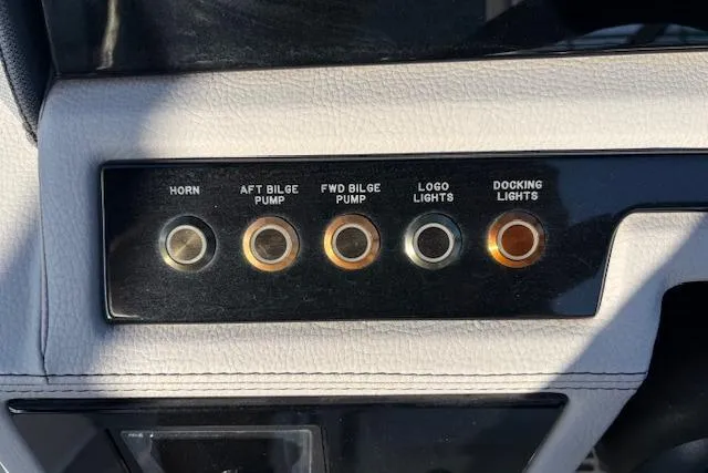Slide: The Image of Control panel of a 2021 Cobalt R6 Outboard boat with labeled buttons. - 34