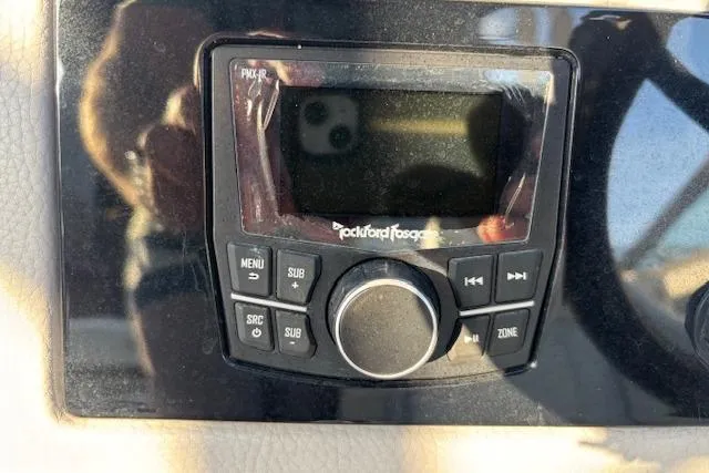 Slide: The Image of Close-up of a Rockford Fosgate audio control panel on a 2021 Cobalt R6 Outboard boat. - 36