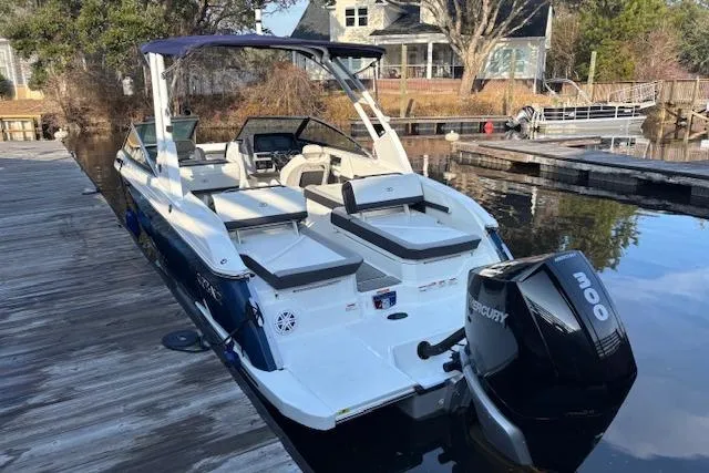 Slide: The Image of 2021 Cobalt R6 Outboard boat docked, featuring a Mercury 300 engine. - 4