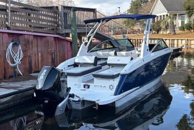 Slide: The Image of 2021 Cobalt R6 Outboard boat docked, featuring sleek design and powerful Mercury engine. - 6