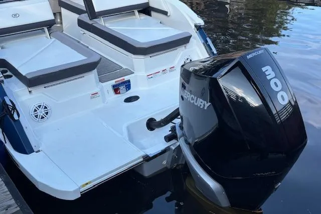 Slide: The Image of 2021 Cobalt R6 Outboard boat with Mercury 300 engine, docked on calm water. - 8