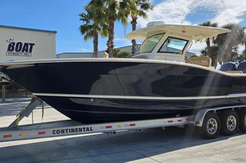 Slide: The Image of 2021 Scout 305 LXF boat on trailer at Boat Dynasty Inc. - 4