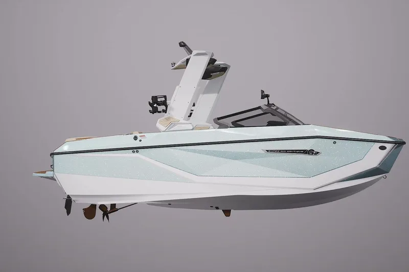 Slide: The Image of 2026 Nautique Super Air Nautique G21 boat, sleek design, side view, white and light blue. - 2
