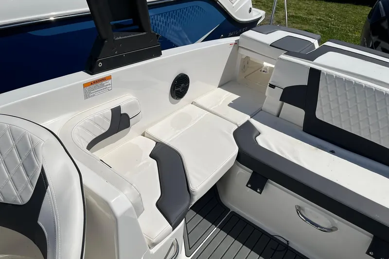 Slide: The Image of 2026 Bayliner VR6 Bowrider OB interior with white and gray seating, modern design. - 10
