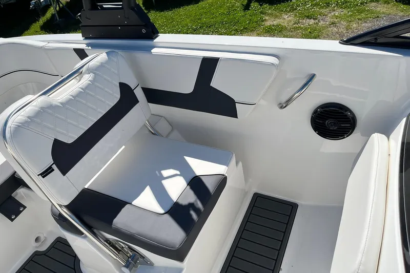 Slide: The Image of 2026 Bayliner VR6 Bowrider OB interior with white seating and black accents. - 11