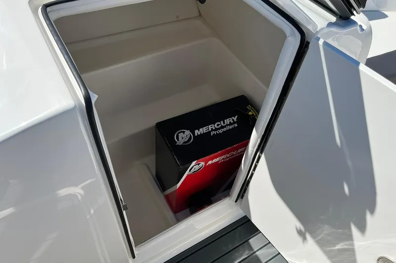 Slide: The Image of Storage compartment in 2026 Bayliner VR6 Bowrider OB with Mercury Propellers box. - 15