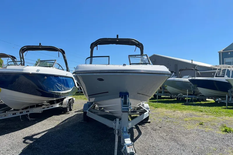 Slide: The Image of 2026 Bayliner VR6 Bowrider OB on trailer, displayed outdoors under clear blue sky. - 4