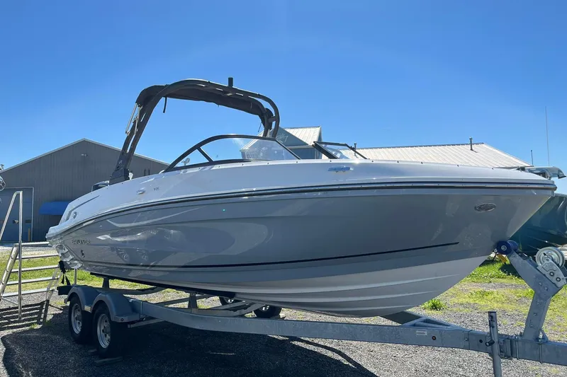 Slide: The Image of 2026 Bayliner VR6 Bowrider OB on trailer under clear blue sky. - 5