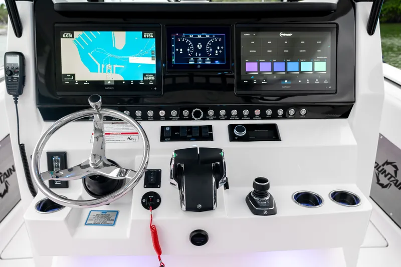 Slide: The Image of 2025 Fountain 38 Center Console boat dashboard with advanced navigation and control systems. - 10