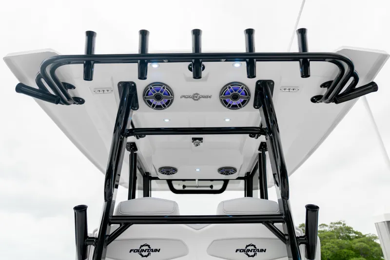Slide: The Image of 2025 Fountain 38 Center Console boat with rod holders and speakers, viewed from below. - 9