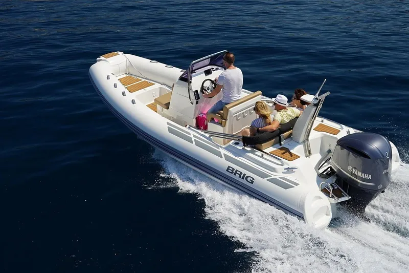 The Image of 2026 Brig Eagle 6.7 boat cruising on open water with passengers enjoying the ride. - 0
