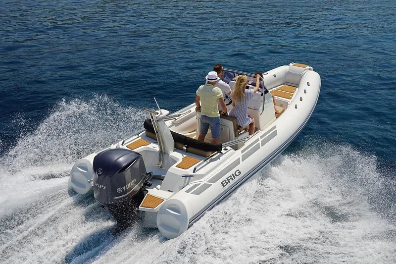 Slide: The Image of 2026 Brig Eagle 6.7 boat cruising on open water with passengers enjoying the ride. - 5