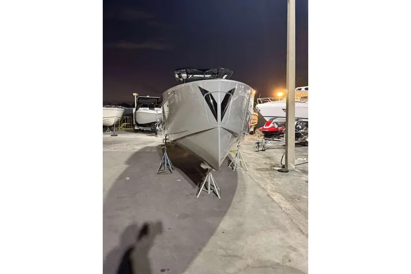 Slide: The Image of 2026 Virtue V10 boat on calm water with city skyline in background. - 106