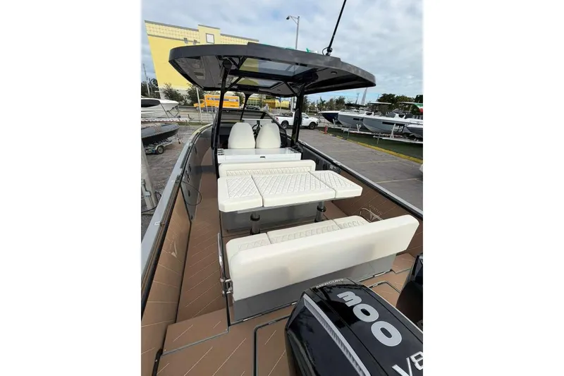 Slide: The Image of 2026 Virtue V10 boat on calm water with city skyline in background. - 109