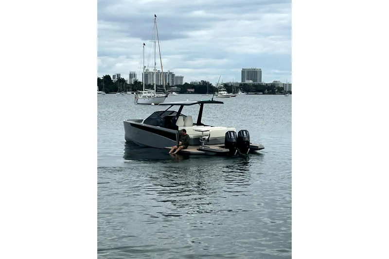 Slide: The Image of 2026 Virtue V10 boat cruising in a marina with other vessels in the background. - 119