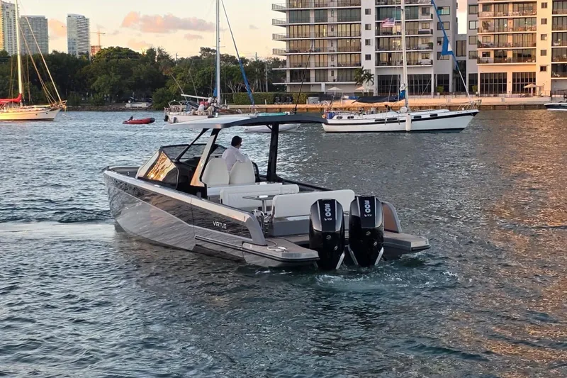 Slide: The Image of 2026 Virtue V10 boat displayed at night under bright lights. - 12