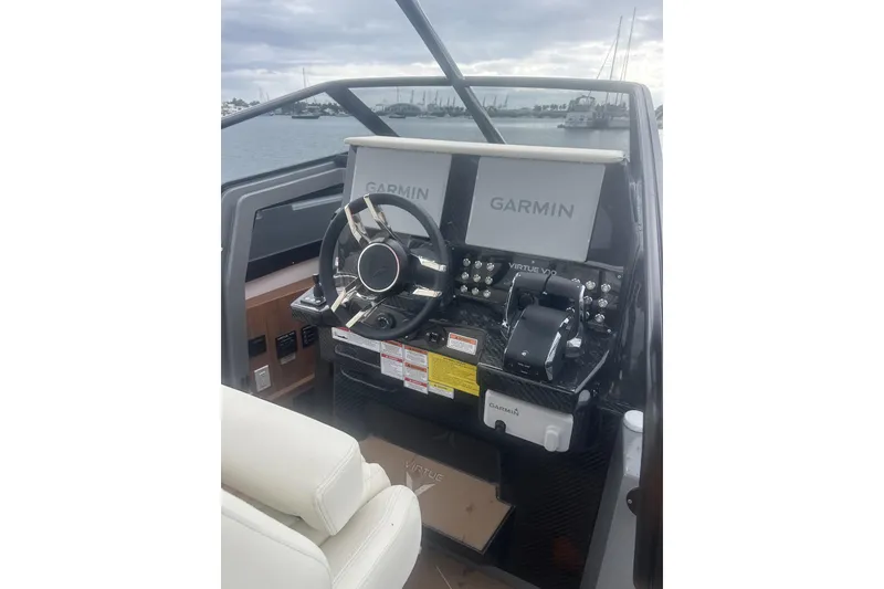 Slide: The Image of Steering console of 2026 Virtue V10 boat with Garmin navigation displays. - 141
