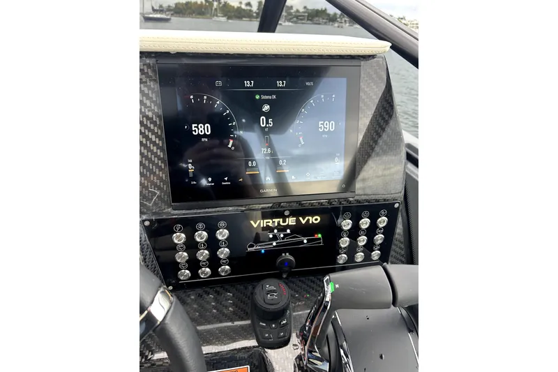 Slide: The Image of Interior of 2026 Virtue V10 boat with wooden accents and seating area. - 18