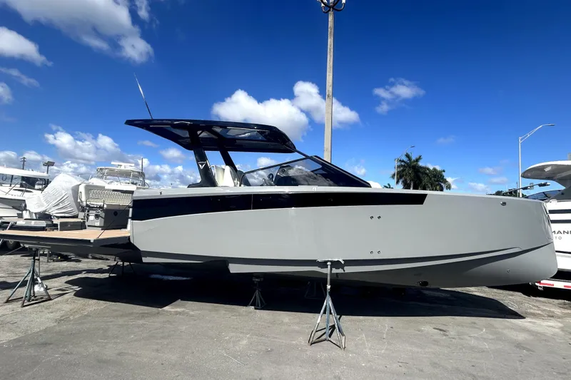 Slide: The Image of 2026 Virtue V10 boat with dual 300 V8 engines on calm water. - 2