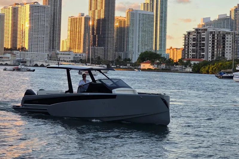 Slide: The Image of 2026 Virtue V10 yacht cruising in urban waterfront with skyscrapers in background. - 27