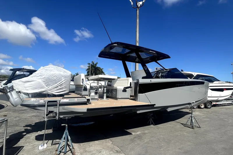 Slide: The Image of Virtue V10 2026 boat on calm water under cloudy sky, featuring sleek design. - 3