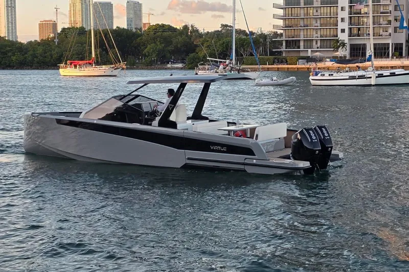 Slide: The Image of Luxury 2026 Virtue V10 boat with dual engines on calm water. - 40