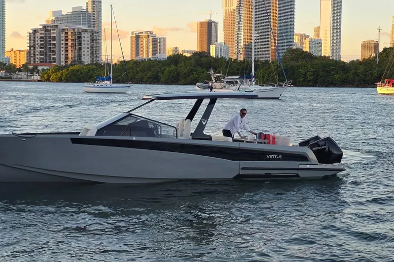 Slide: The Image of 2026 Virtue V10 boat on calm water under cloudy sky. - 51