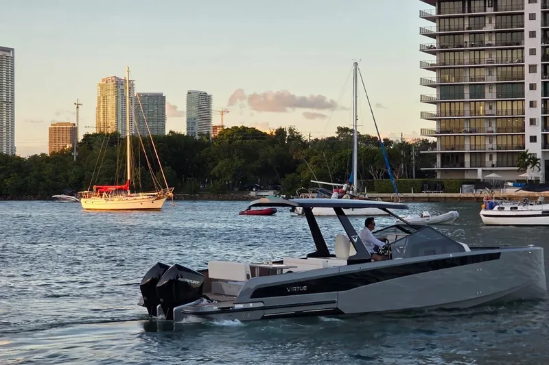 Slide: The Image of 2026 Virtue V10 boat on calm water under cloudy sky. - 54