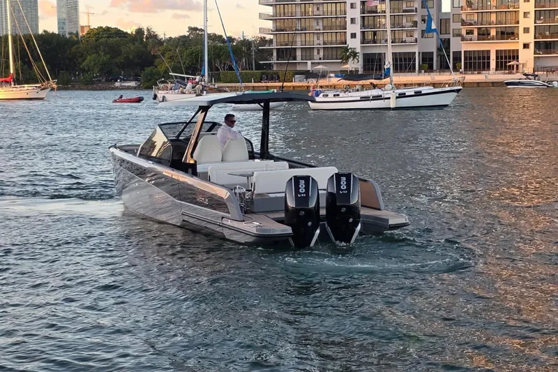 Slide: The Image of 2026 Virtue V10 boat on calm water, overcast sky, modern design. - 6