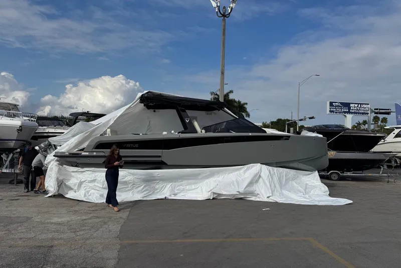 Slide: The Image of 2026 Virtue V10 boat on calm water with cloudy sky backdrop. - 61