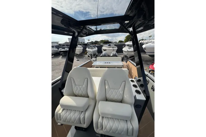 Slide: The Image of Modern 2026 Virtue V10 boat cruising on calm waters under a cloudy sky. - 63