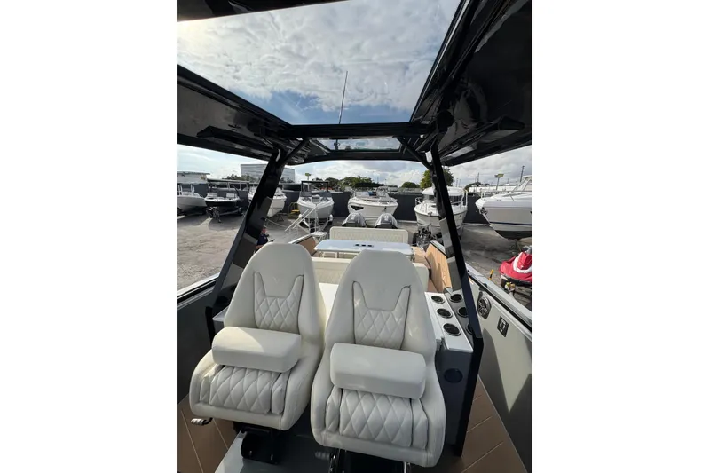 Slide: The Image of 2026 Virtue V10 boat on water, featuring dual outboard motors and sleek design. - 67