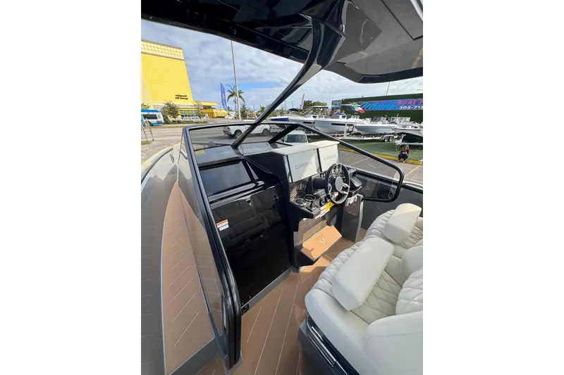 Slide: The Image of 2026 Virtue V10 boat on calm water with city skyline in background. - 68