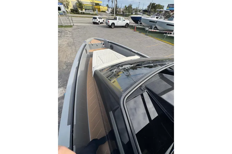 Slide: The Image of Modern 2026 Virtue V10 boat cruising on calm waters under a cloudy sky. - 69