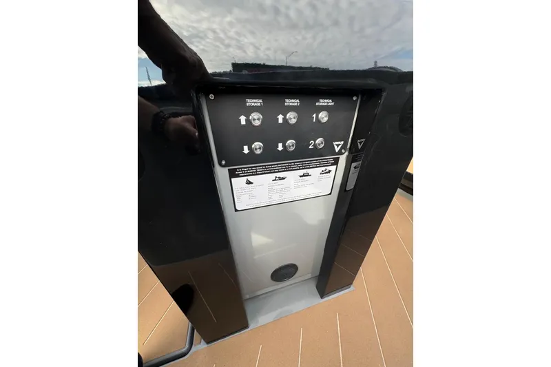 Slide: The Image of 2026 Virtue V10 boat on calm water, showcasing sleek design and luxurious deck. - 78