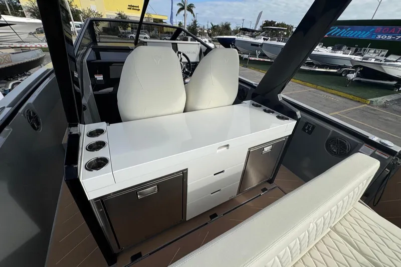 Slide: The Image of Luxurious interior of 2026 Virtue V10 boat with sleek white seating and cabinetry. - 79