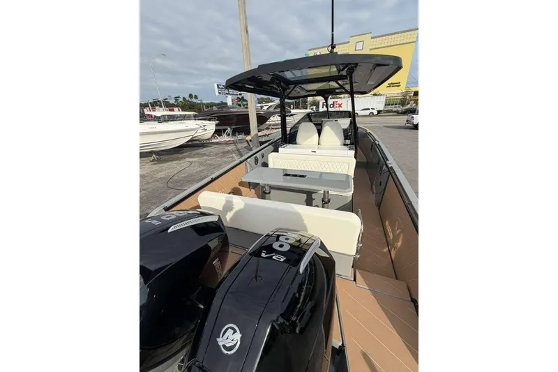 Slide: The Image of Interior view of 2026 Virtue V10 boat cockpit with modern design and waterfront backdrop. - 91