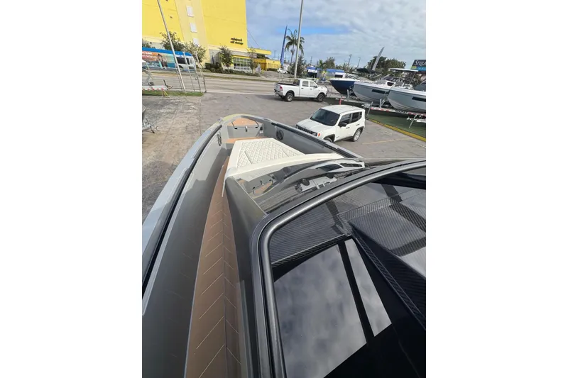 Slide: The Image of 2026 Virtue V10 boat on calm water under cloudy sky. - 97