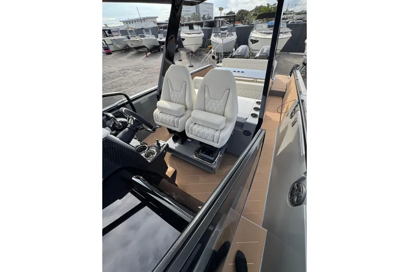 Slide: The Image of 2026 Virtue V10 boat on calm water under cloudy sky. - 98