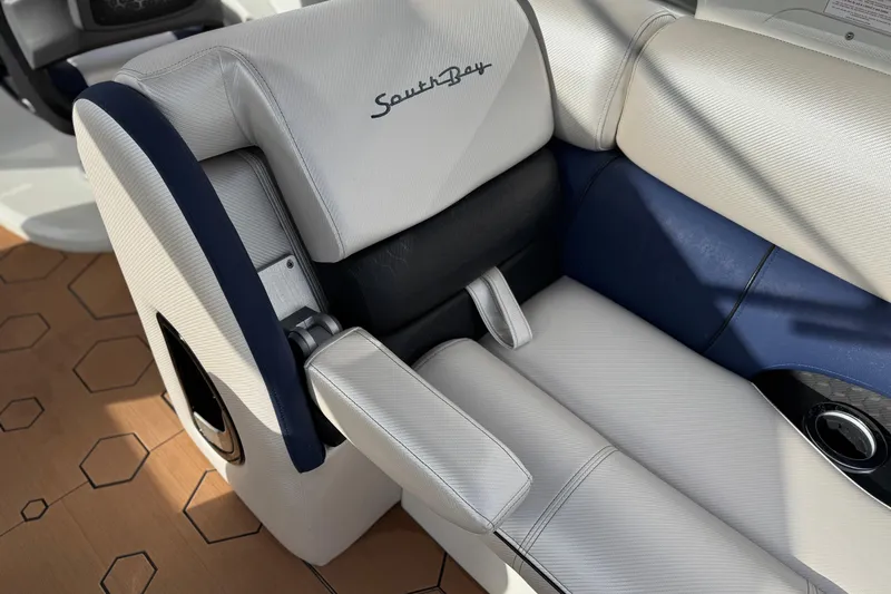 Slide: The Image of Luxury seating on 2022 South Bay 25 Sport RS9-DC boat, featuring premium upholstery. - 17