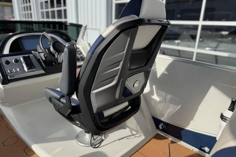 Slide: The Image of Captain's chair and dashboard of 2022 South Bay 25 Sport RS9-DC boat. - 20
