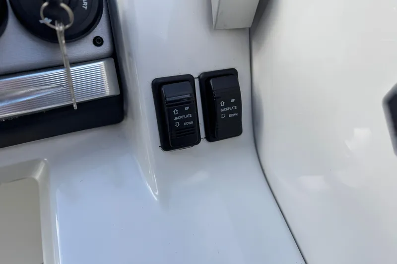 Slide: The Image of Control panel of 2022 South Bay 25 Sport RS9-DC with jackplate switches. - 28