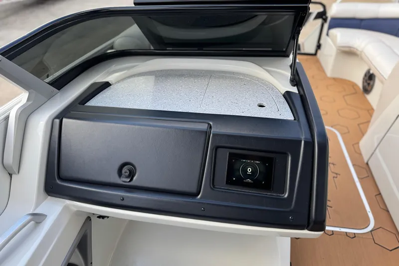 Slide: The Image of 2022 South Bay 25 Sport RS9-DC boat dashboard with touchscreen display and seating area. - 30